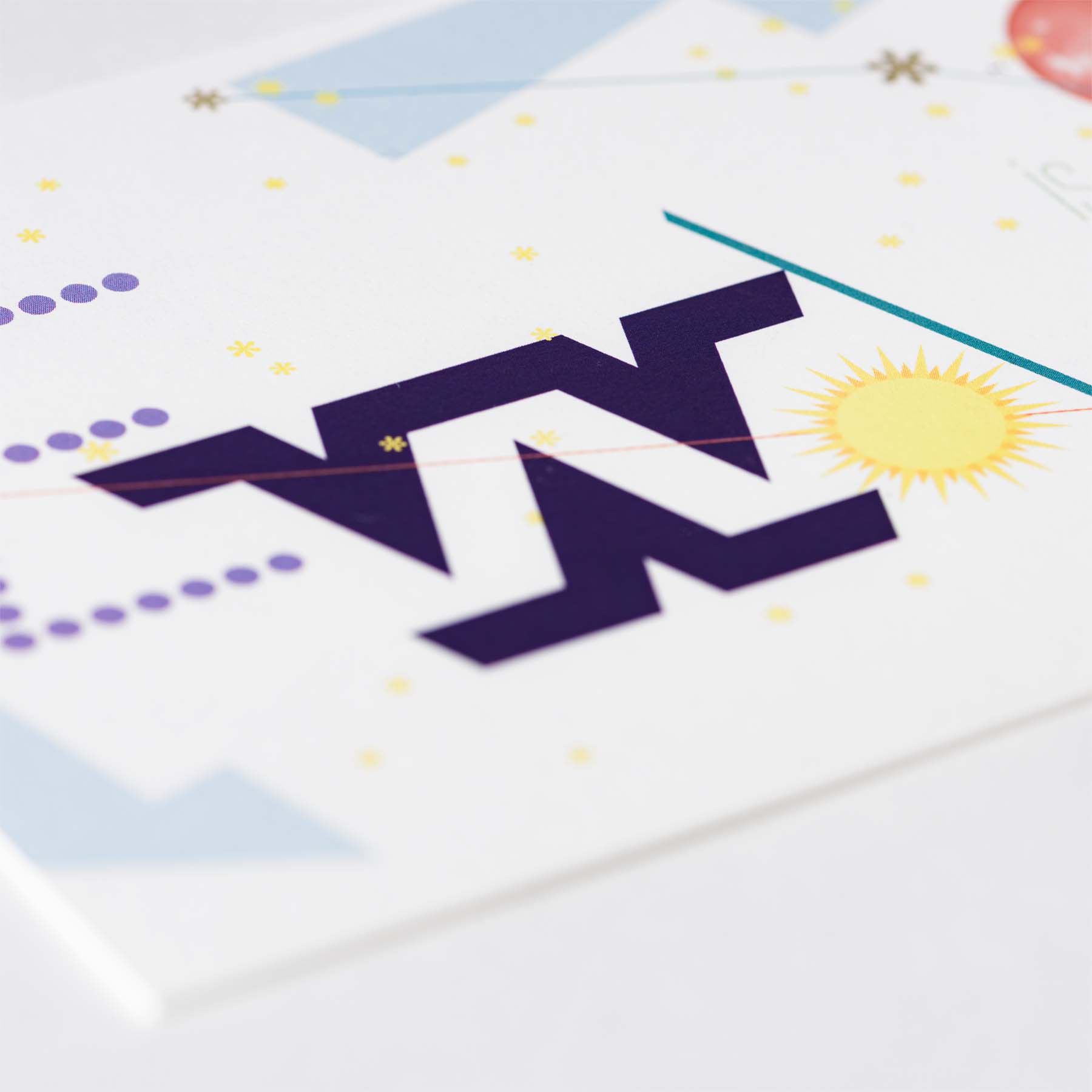 Front of birth announcement card with custom letterforms 'E', 'W', 'A'.